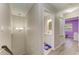 Hallway leads to the bathroom and bedroom, featuring a modern light fixture at 3717 Delta St # 95, Sarasota, FL 34232