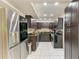 Modern kitchen with stainless steel appliances, sleek cabinetry, and bright recessed lighting at 3717 Delta St # 95, Sarasota, FL 34232
