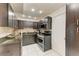 Updated kitchen featuring granite countertops, stainless steel appliances, and tiled backsplash at 3717 Delta St # 95, Sarasota, FL 34232