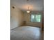 Cozy dining room featuring tile floors, natural light and access to other rooms at 3799 Countryside Rd, Sarasota, FL 34233