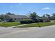 Well maintained home with lush landscaping, and a large green lawn at 3799 Countryside Rd, Sarasota, FL 34233