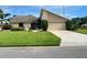 Charming single-Gathering home with a manicured lawn, mature landscaping, and a two-car garage at 3799 Countryside Rd, Sarasota, FL 34233