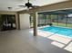 Screened in lanai showing view of pool and access to the yard at 3799 Countryside Rd, Sarasota, FL 34233