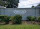 The 'CountryPlace' sign surrounded by greenery is made of painted brick at 3799 Countryside Rd, Sarasota, FL 34233