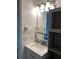 Bathroom vanity with marble countertop and cabinet storage at 3806 N Oak Dr # V92, Tampa, FL 33611