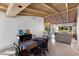 Open-concept dining room featuring vaulted wood ceiling, tile flooring, and access to the living room at 426 S Shore Dr, Sarasota, FL 34234