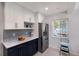 Bright kitchen featuring two-tone cabinets, stainless steel appliances and a window view at 426 S Shore Dr, Sarasota, FL 34234