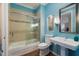 Bright and colorful bathroom with shower-tub and pedestal sink at 4481 Cinnamon Dr # 2601, Sarasota, FL 34238