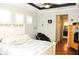Comfortable bedroom with hardwood floors and ensuite bathroom at 4506 62Nd E Ter, Bradenton, FL 34203