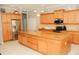 Spacious kitchen with an island, granite counters, and stainless steel appliances at 4506 62Nd E Ter, Bradenton, FL 34203