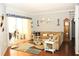 Comfortable living room featuring hardwood flooring and neutral-toned decor at 4506 62Nd E Ter, Bradenton, FL 34203