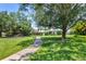 Neighborhood playground with lush lawns, mature landscaping, and a walking path at 4506 62Nd E Ter, Bradenton, FL 34203