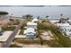 A beautiful aerial view of waterfront homes with manicured lawns and a serene view of the water at 4524 106Th W St, Bradenton, FL 34210