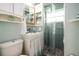 Updated bathroom with walk-in glass shower, white vanity, and blue tile backsplash at 4524 106Th W St, Bradenton, FL 34210