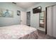 Serene bedroom with beach-themed decor and plenty of natural light from windows and closet mirror at 4524 106Th W St, Bradenton, FL 34210