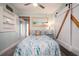 Cozy bedroom features wood-look floors, light blue walls, and decor with a nautical theme at 4524 106Th W St, Bradenton, FL 34210
