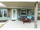 Inviting front porch with cozy seating area, enhancing the home's exterior charm at 4524 106Th W St, Bradenton, FL 34210