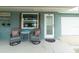 Charming front porch with seating area, decorative touches and welcoming entrance at 4524 106Th W St, Bradenton, FL 34210