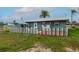 Charming home with a colorful picket fence, well-manicured lawn, and inviting curb appeal at 4524 106Th W St, Bradenton, FL 34210