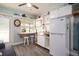 Cozy kitchen with white cabinets, breakfast bar and white appliances evokes a seaside charm at 4524 106Th W St, Bradenton, FL 34210