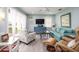 Cozy living room with bright, natural light, stylish furnishings, and soothing coastal decor at 4524 106Th W St, Bradenton, FL 34210