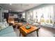 Comfortable living room with stylish furniture, hardwood floors, and an open view into the adjacent kitchen at 4524 106Th W St, Bradenton, FL 34210