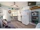 Efficiency living space with a sofa, kitchenette, bar seating, and wood-look flooring at 4524 106Th W St, Bradenton, FL 34210