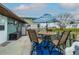 Outdoor patio with seating under an umbrella, perfect for relaxing and entertaining by the water at 4524 106Th W St, Bradenton, FL 34210