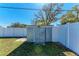 Backyard features a metal shed with a white privacy fence at 4550 Ardale St, Sarasota, FL 34232