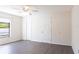Neutral-toned bedroom featuring a ceiling fan, laminate floors, and two closets, offering comfort and ample storage at 4659 Alligator Dr, Venice, FL 34293