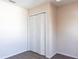 A bedroom featuring wood look floors and a closet provides a versatile space for rest and storage at 4659 Alligator Dr, Venice, FL 34293