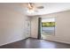 This bedroom features hardwood floors, a ceiling fan and a door that provides access to the outside at 4659 Alligator Dr, Venice, FL 34293