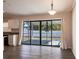 Inside view of the living area, which offers an adjoining view of a covered lanai and access to the kitchen at 4659 Alligator Dr, Venice, FL 34293