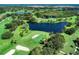 Scenic aerial shot of the lush golf course with picturesque ponds and sand traps at 5 Barbados Rd # 31, Englewood, FL 34223