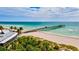 Beautiful aerial view of the pier, beach, and clear turquoise waters at 5 Barbados Rd # 31, Englewood, FL 34223