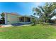 Spacious backyard with patio and lush landscaping creates a private outdoor oasis at 5 Barbados Rd # 31, Englewood, FL 34223