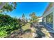 A view of the backyard, and the garden and landscaping it features at 5 Barbados Rd # 31, Englewood, FL 34223