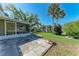 Landscaped backyard features a patio, lush greenery, and privacy fence at 5 Barbados Rd # 31, Englewood, FL 34223