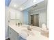 Bathroom featuring vanity with a large mirror, modern fixtures, and a glass-enclosed shower at 5 Barbados Rd # 31, Englewood, FL 34223