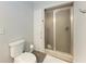 Bathroom showcasing a glass enclosed shower, toilet, and linen closet, all with neutral wall paint at 5 Barbados Rd # 31, Englewood, FL 34223