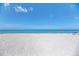 Clear blue ocean meets a white sandy beach, perfect for swimming, sunbathing, and enjoying the seaside at 5 Barbados Rd # 31, Englewood, FL 34223