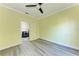 Bedroom with modern flooring and a glimpse of a laundry room through a doorway at 5 Barbados Rd # 31, Englewood, FL 34223