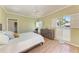 Cozy bedroom features shuttered windows, wood floors, and neutral décor at 5 Barbados Rd # 31, Englewood, FL 34223