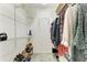 Walk-in closet with ample shelving and clothing racks for organized storage at 5 Barbados Rd # 31, Englewood, FL 34223