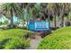 Welcoming Venice Beach sign surrounded by lush tropical landscaping at 5 Barbados Rd # 31, Englewood, FL 34223