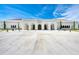 Elegant public library featuring classic architecture, arched entryways, and manicured landscaping under a bright sky at 5 Barbados Rd # 31, Englewood, FL 34223
