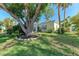 Charming home with mature trees, lush lawn, and inviting curb appeal at 5 Barbados Rd # 31, Englewood, FL 34223