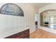 Hallway with beautiful hardwood floors, decorative accents, and a view into other rooms at 5 Barbados Rd # 31, Englewood, FL 34223