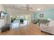 Spacious living room featuring hardwood floors, modern furniture, and ample natural light at 5 Barbados Rd # 31, Englewood, FL 34223