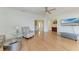 Open living space with hardwood floors, stylish furniture, and seamless transition to other rooms at 5 Barbados Rd # 31, Englewood, FL 34223